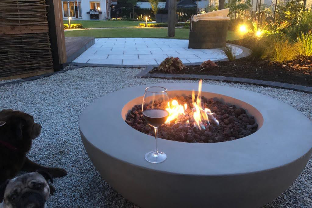 A firepit located near a garden room